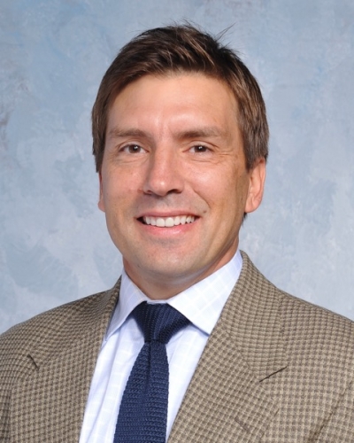 Mark Grebener, licensed clinical social worker, licensed addiction counselor, certified hypnotherapistit jacket, white shirt, and blue necktie
