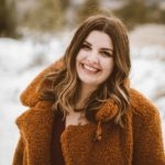 Blakely Sjostedt Williams, licensed clinical social worker, outdoors in winter, wearing a heavy jacket and smiling