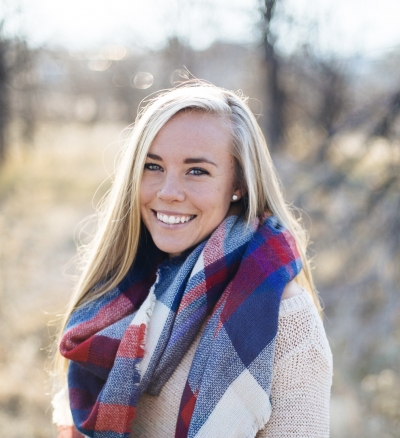Samantha Harder, licensed professional counselor, outdoors, smiling, wearing a white sweater and a colorful scarf