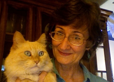 Elizabeth Brandon, licensed marriage and family therapist and certified addiction specialist, holding her cat Beauty