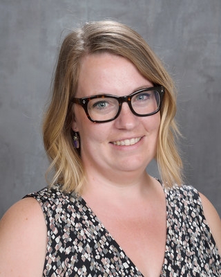 Ann Robinson, licensed clinical social worker, wearing glasses and with shoulder length, light-colored hair