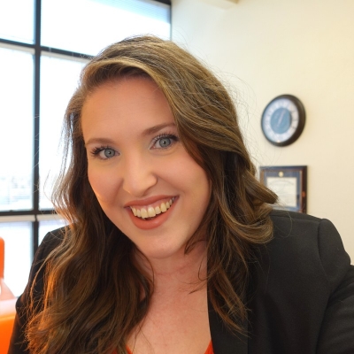 Emily Altman, licensed professional counselor, smiling in an office