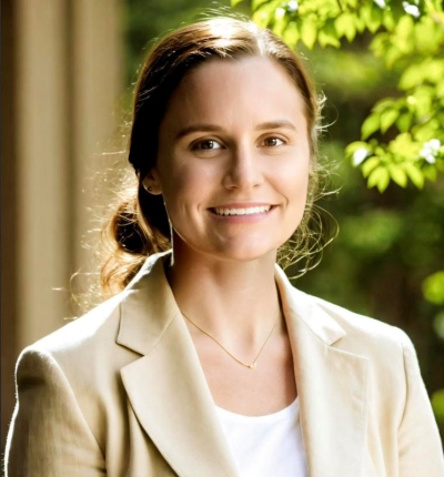 Mary Haas, licensed clinical social worker, smiling, wearing a white top and crea- colored jacket