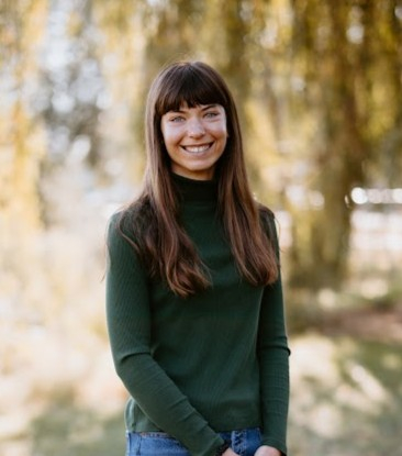 Amy Tuttle, licensed clinical social worker, smiling standing outdoors