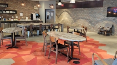 Broomfield office location with an open area and several tables and chairs