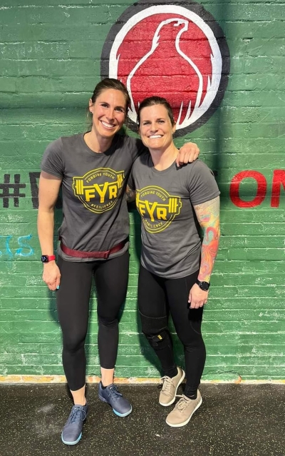 Mindset Reps coaches standing next to each other in a gymnasium