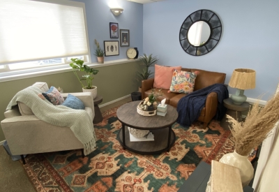 Office with sofa, comfortable chair, window.