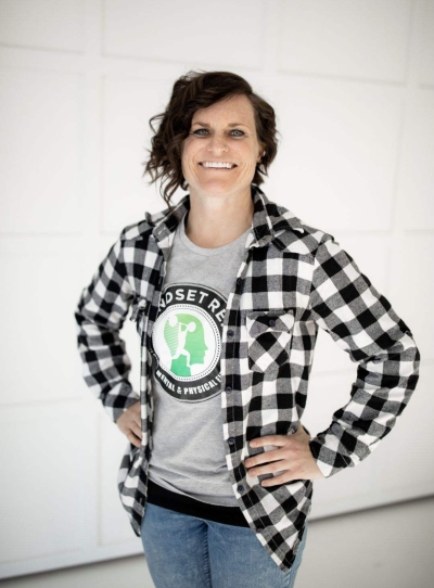 Jeanette Jennings, licensed professional counselor, smiling, wearing a Mindset Rep t-shirt, checked shirt, and jeans