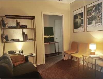 Waiting area with chairs and sofa