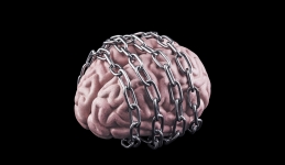 Picture of a brain with a chain around it. 