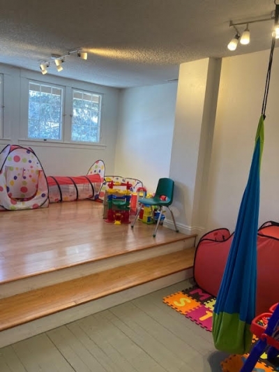 Room with ball pit, hammock swing, toys, foam floor mats