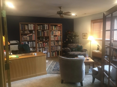 Sunlight steams into the room, onto the client's chair and Arleen's desk. A candle may be lit and a water feature may be used.