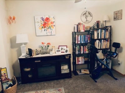 Office with bookcases and desk with chair