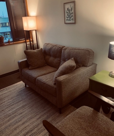 Kindred Counseling Office 2, with loveseat, window, and lamps