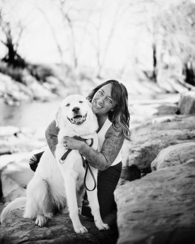 B/W picture of Tricia and her therapy dog, Millie