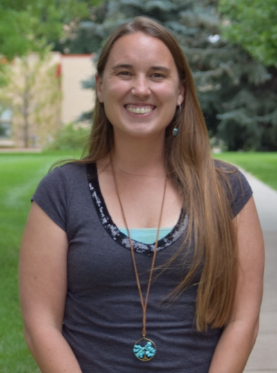 Natalie Rolle, smiling, standing outside at CSU